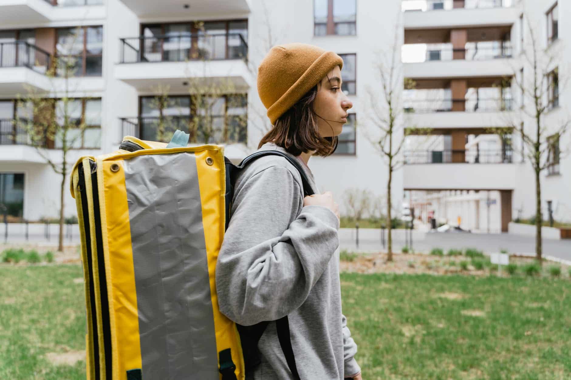 woman carrying a yellow bag